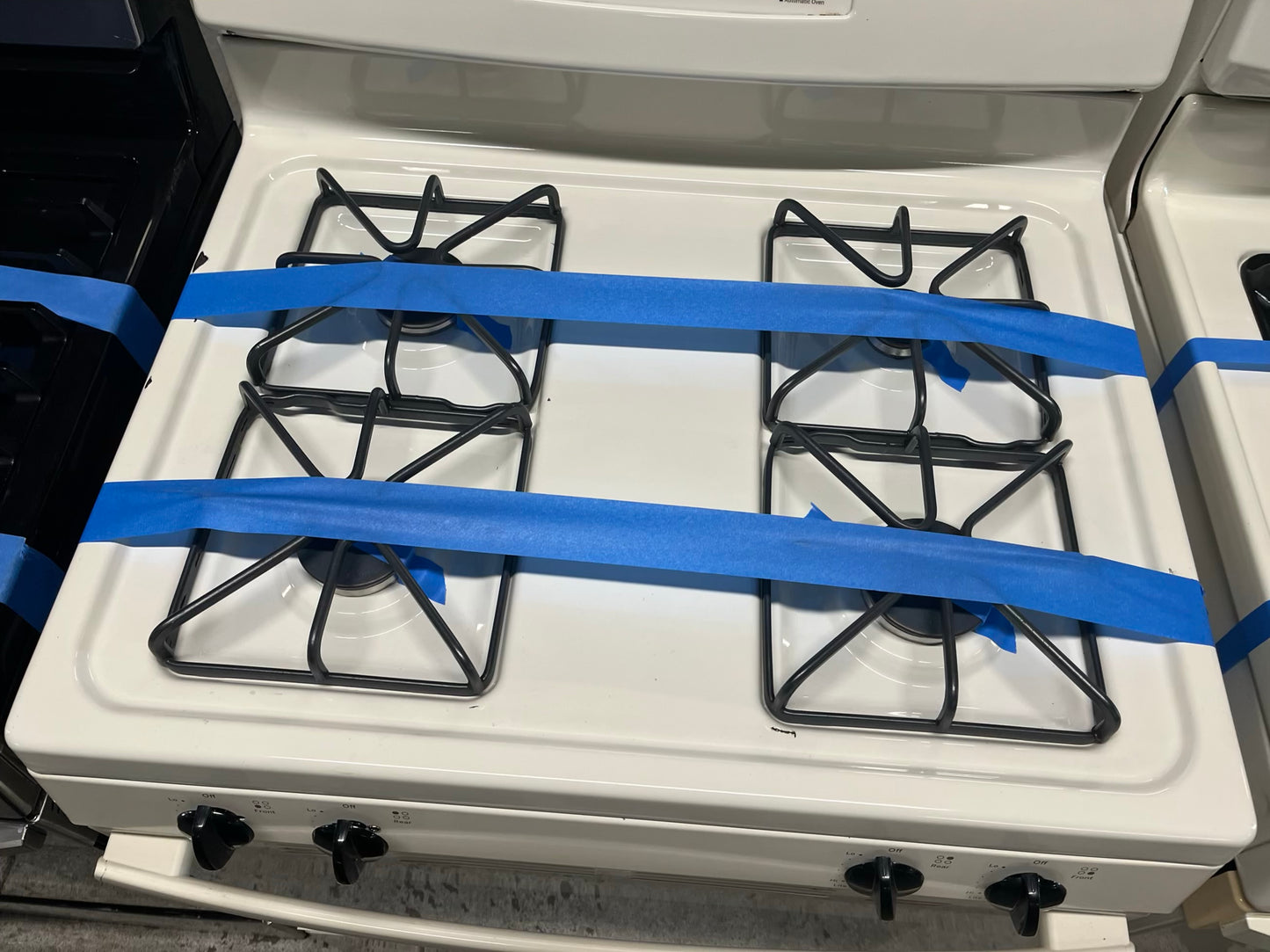 - GE Gas range 4 burner bake broil hi/lo in off white Refurbished 30" #GR235WB