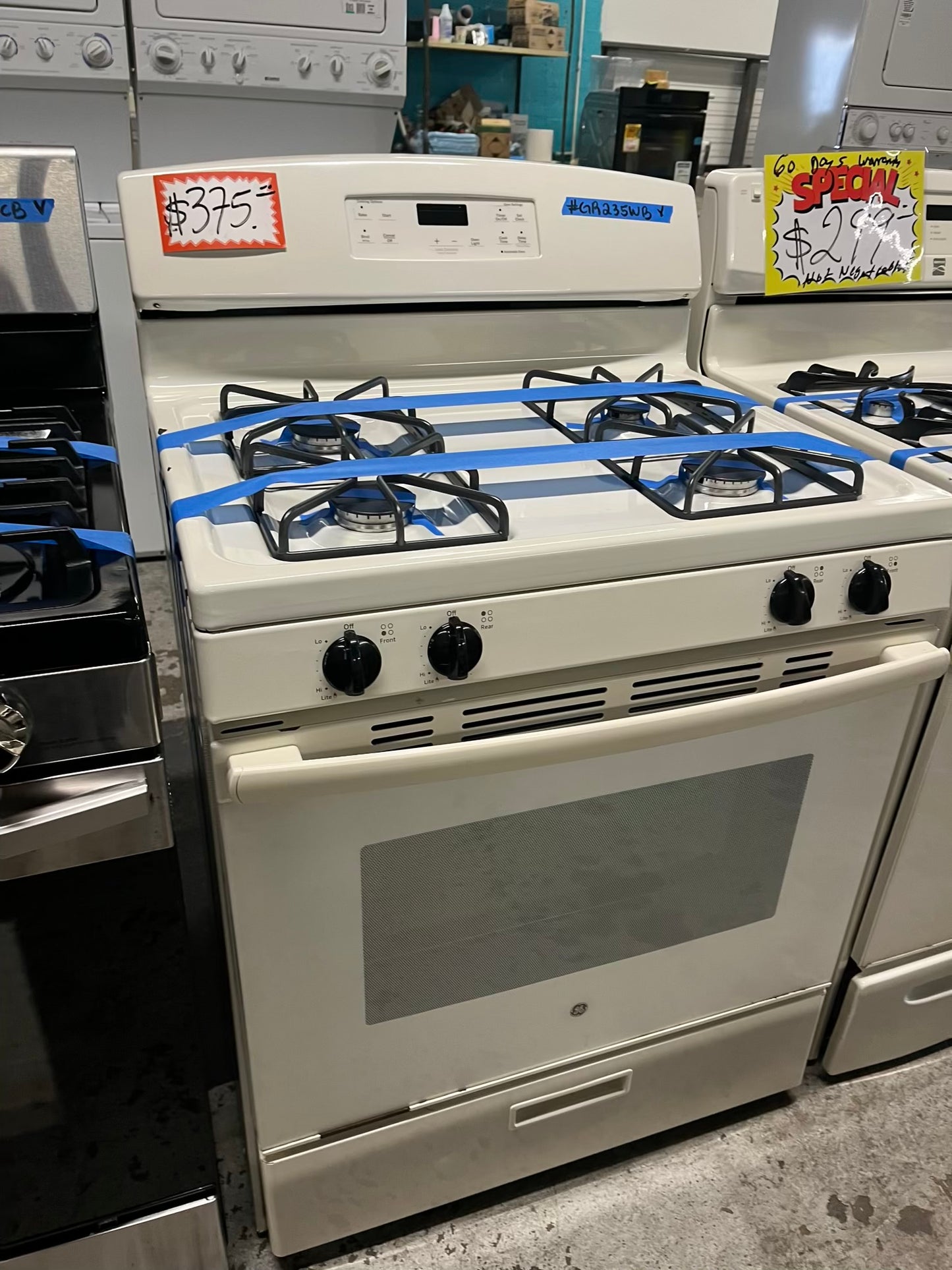 - GE Gas range 4 burner bake broil hi/lo in off white Refurbished 30" #GR235WB