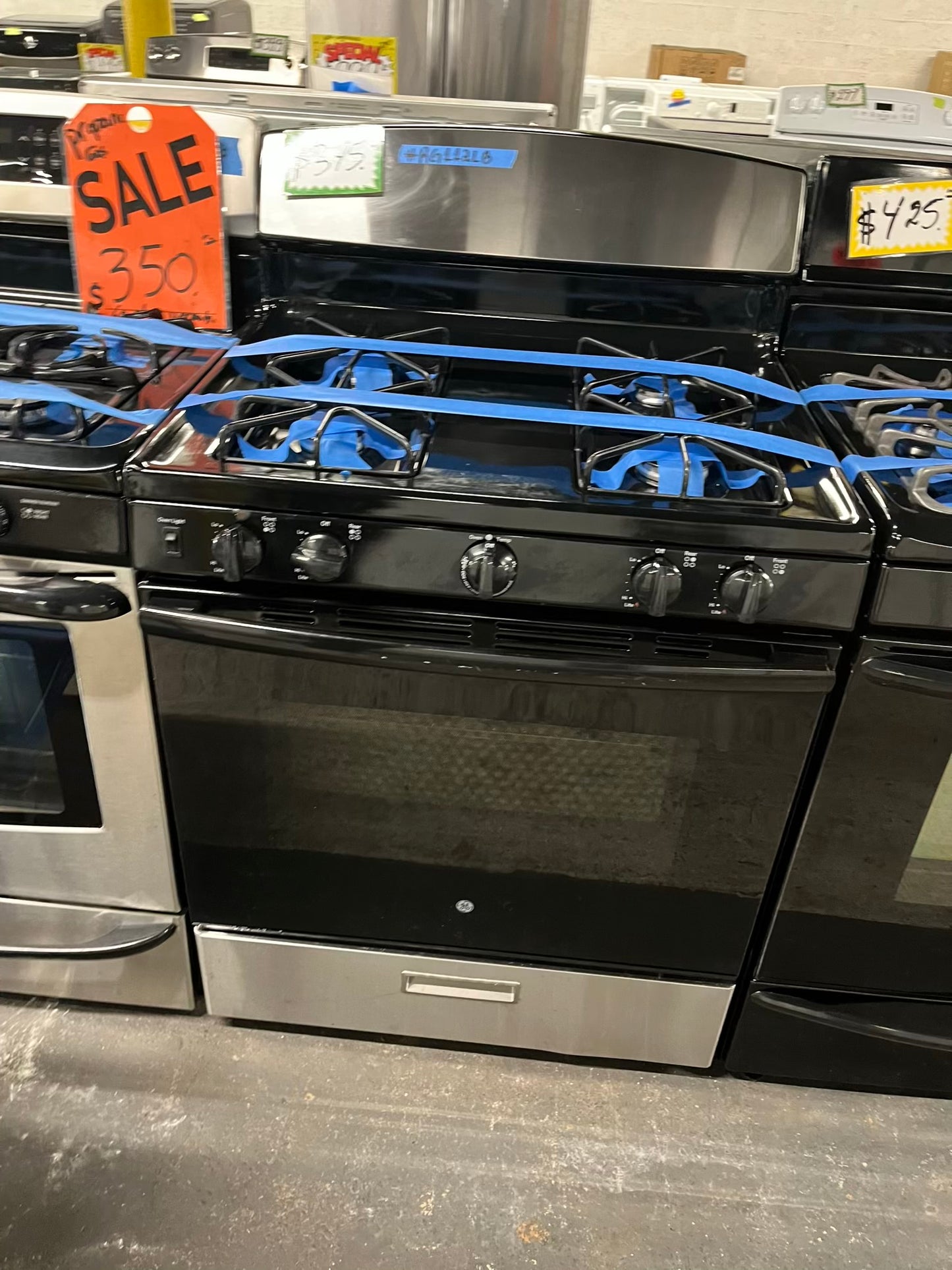 - GE GAS range black & stainless steel 4 burner bake broil 30” item number #RG112LB