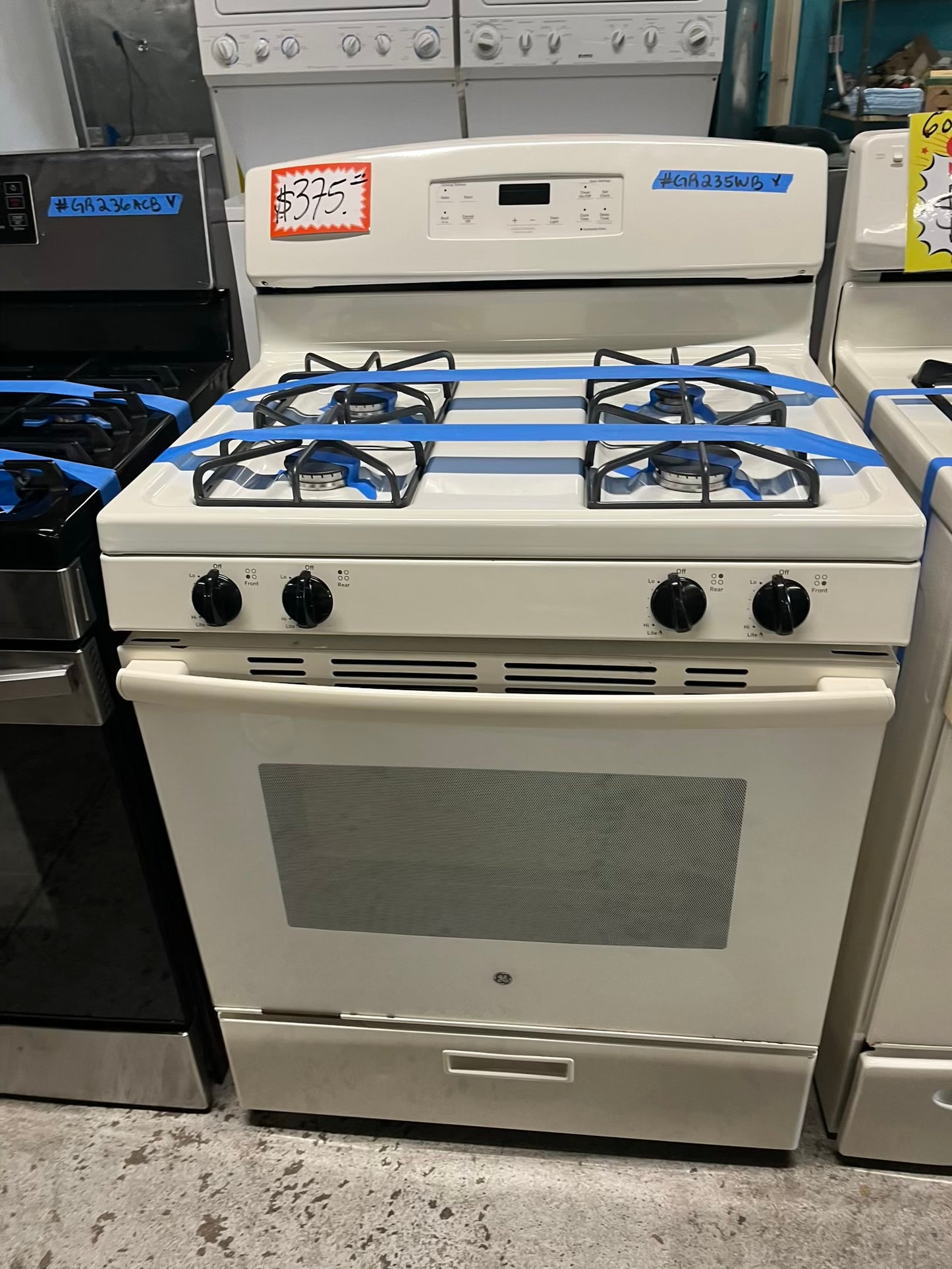 - GE Gas range 4 burner bake broil hi/lo in off white Refurbished 30" #GR235WB