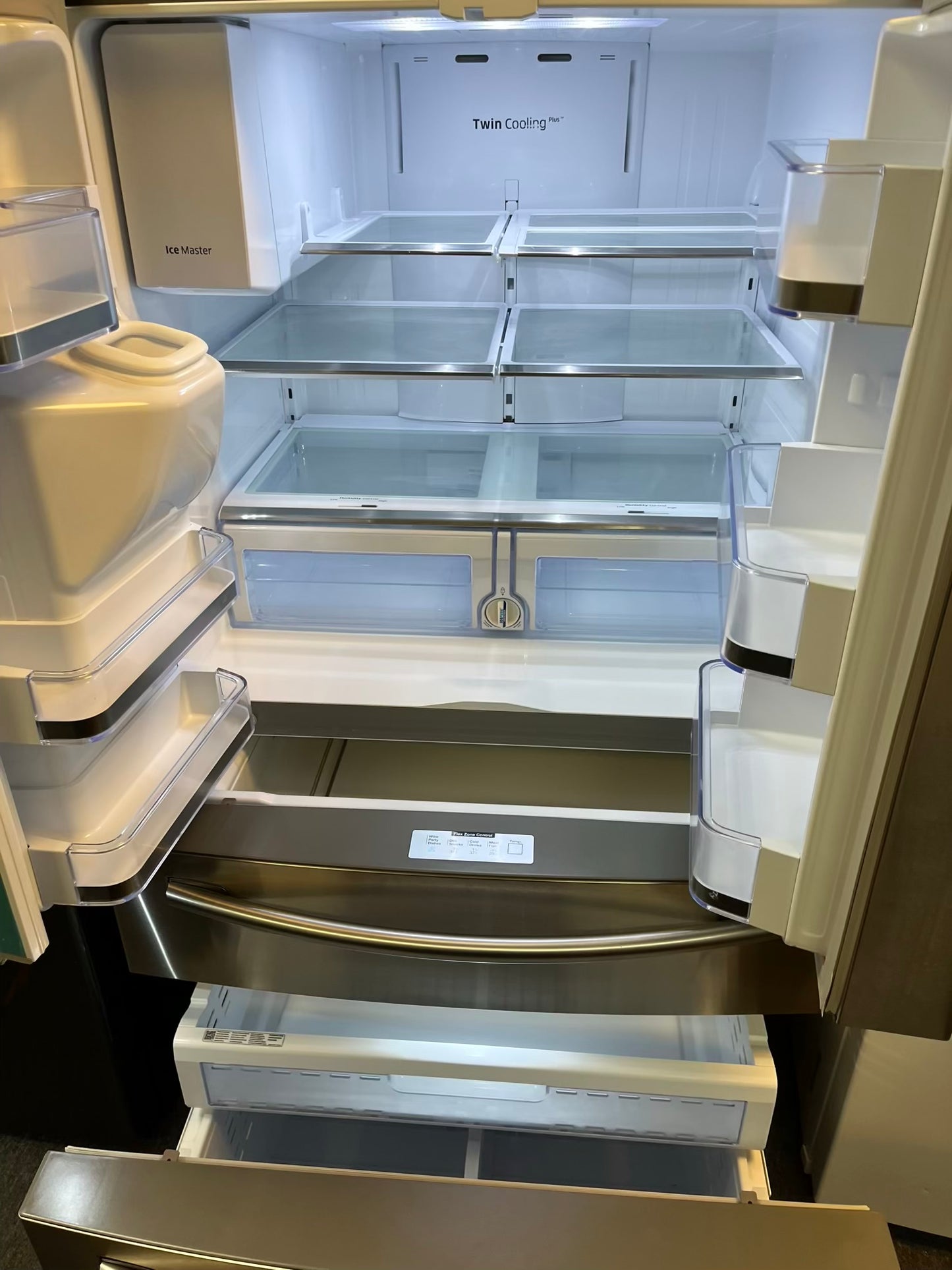 Used | Refurbished Samsung four door refrigerator stainless steel w/ice water dispenser 36" #RF502YL