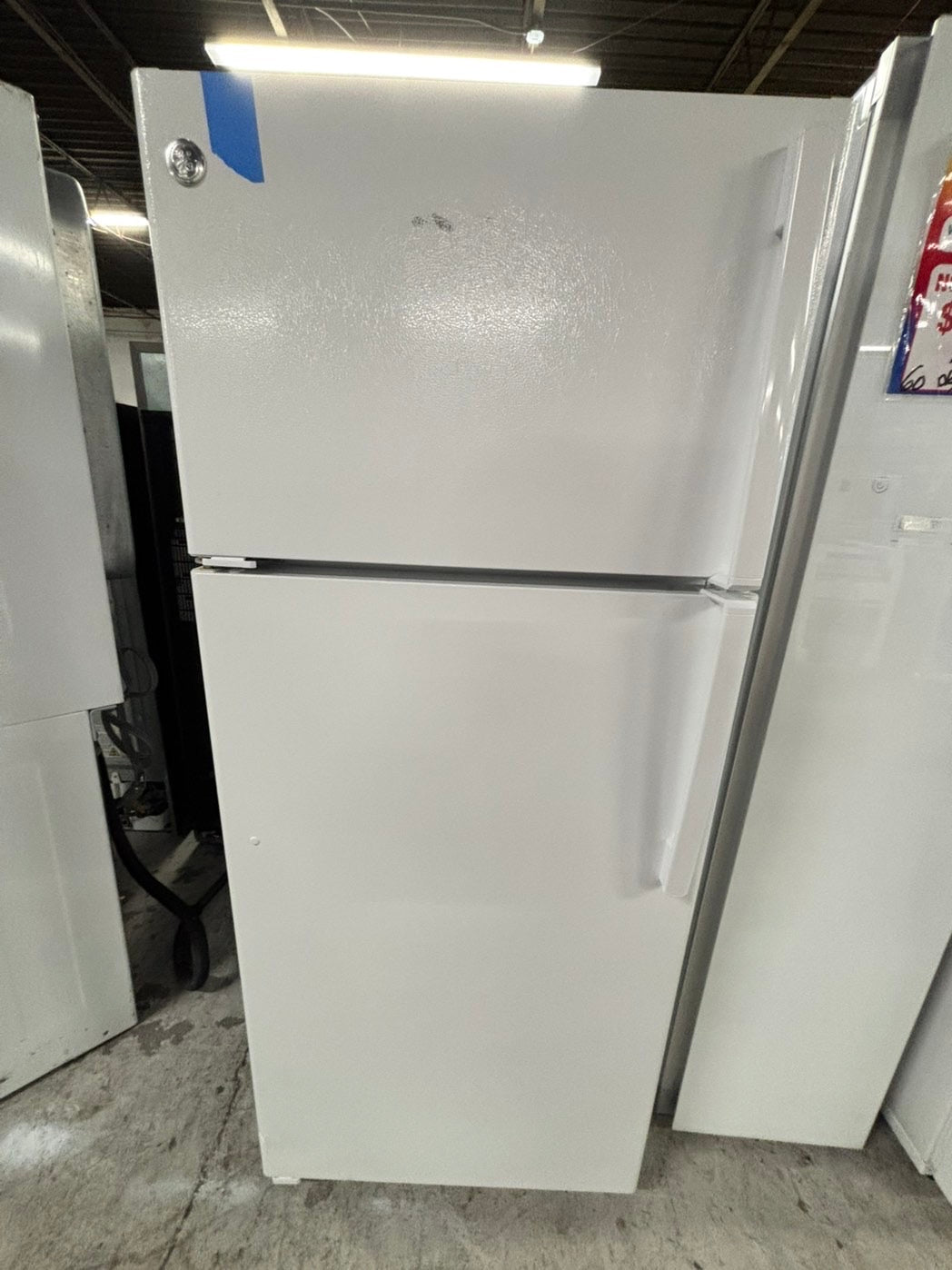 * GE used like new-top freezer refrigerator in white no ice maker 28" #RF1139FB