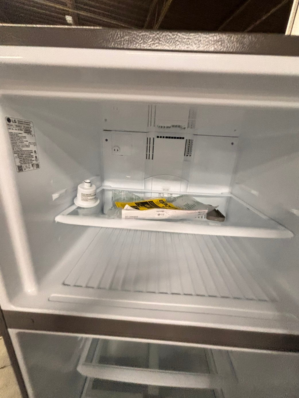 >new open box costumer return scratch & debt LG 33” Top freezer fridge, stainless #RLCF3C2B