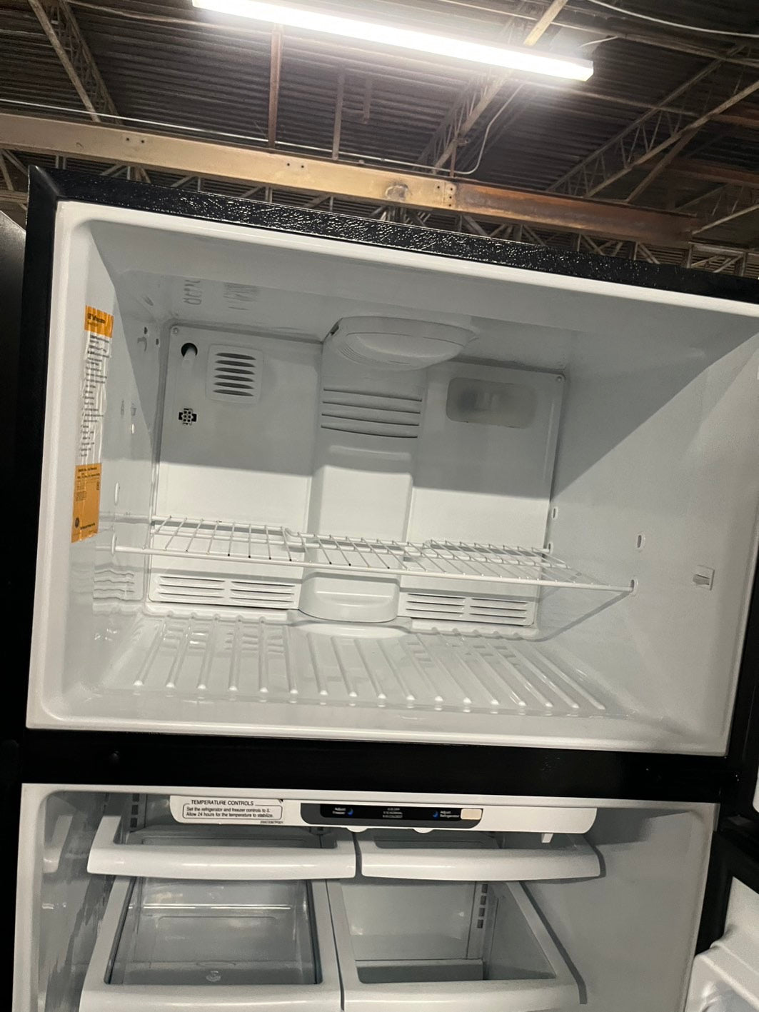 = Ge 33” Top freezer fridge  black refurbished #RFTB67B