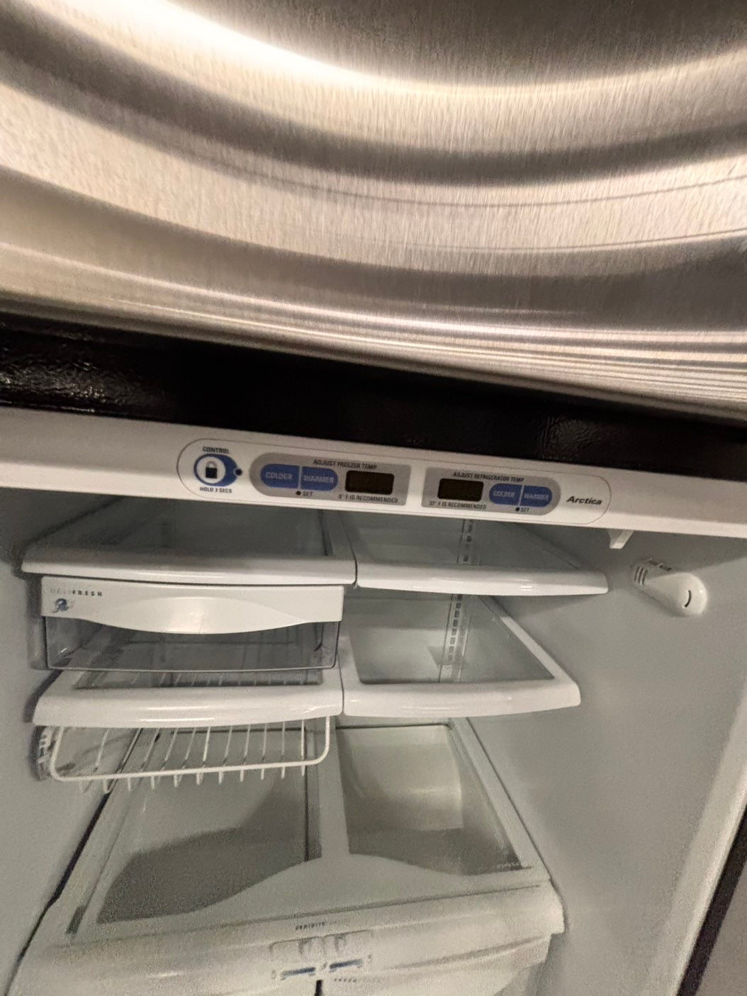 >GE  33” Top freezer fridge   ,stainless steel. used-refurbished #RG41T2B