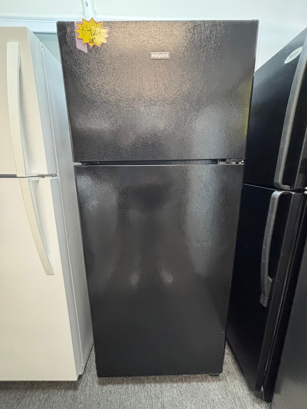 >Hot point  28”top freezer fridge black used-refurbished #HJX13B